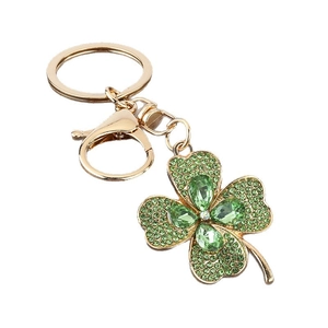 Luxury gold clover keychain with green pear-shaped crystals and sparkling rhinestone accents