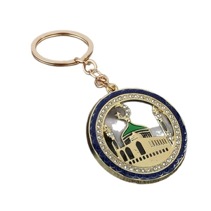 Golden Muslim keychain with mosque star moon emblem and sparkling blue green crystals