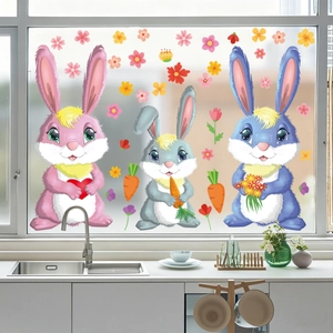 Detailed view of colorful cartoon Easter bunnies and carrots static stickers on glass