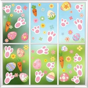 Colorful Easter window stickers with bunny paws, eggs, and carrots on a window pane