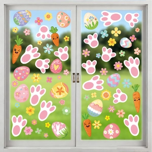 Easter window decals featuring bunny paws, colorful eggs and carrots on a glass door