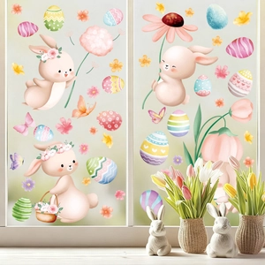 Detail of watercolor Easter bunny and eggs static window decals on a glass surface