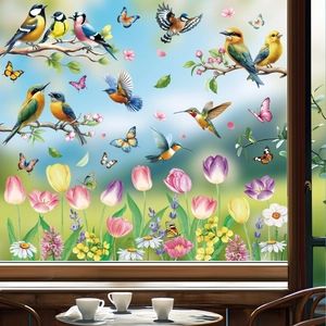 Detail of colorful hummingbird and tulip static window decals in a cozy indoor setting