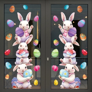 Easter window stickers with stacked white bunnies and colorful patterned eggs on glass
