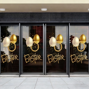 Detailed view of golden Easter egg wall stickers on a glass store window display