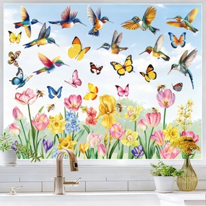 Close-up of hummingbird and floral static window clings on kitchen glass surfaces