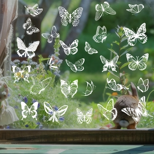 White butterfly static window clings set for spring glass decoration with floral garden view