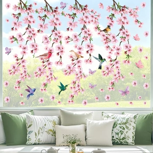Detail of cherry blossom window clings with realistic birds and butterfly decorations