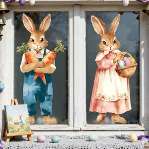Close-up of Easter bunny window stickers with watercolor rabbits and colorful eggs on glass