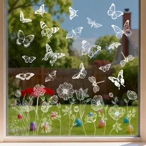 White butterfly and floral static window clings on glass with a spring garden background