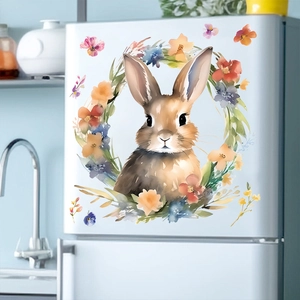 Detail of watercolor Easter bunny and floral wreath sticker on a white refrigerator surface