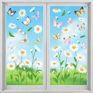 Close-up of butterfly and daisy window stickers on glass with a soft garden background