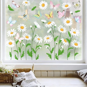 Detailed view of daisy and butterfly static window clings on bright glass background
