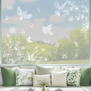 White line art window decals featuring birds and flowers on transparent glass