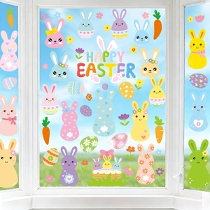 Detailed view of colorful cartoon bunny and Happy Easter window stickers on glass