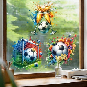 Detail view of soccer-themed static window stickers with champagne and football designs