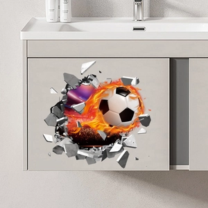 Détail d'un sticker mural 3D football avec flammes et effet mur fissuré sur meuble gris
