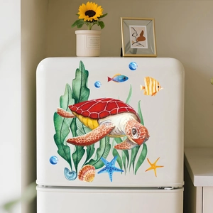 Macro view of watercolor sea turtle and tropical fish stickers on a white fridge
