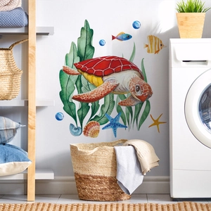 Detailed watercolor sea turtle and tropical fish wall stickers in a laundry room decor