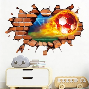 Close-up of 3D flaming football wall decal breaking through a brick wall in a bedroom