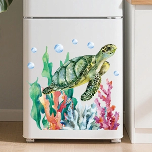 Macro detail of watercolor sea turtle and coral stickers applied to white refrigerator