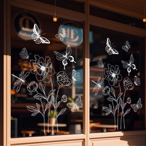 Detailed white hand-drawn butterfly and flower window stickers on a glass pane