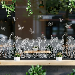 White butterfly and floral static glass stickers on a coffee shop window display