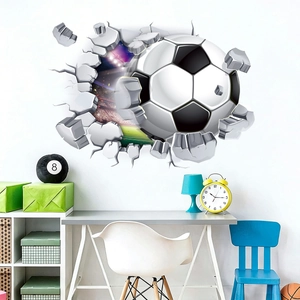 3D football wall decal showing a soccer ball breaking through a white stone wall effect