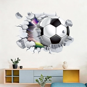 Detailed view of 3D football wall sticker breaking through a white brick wall background