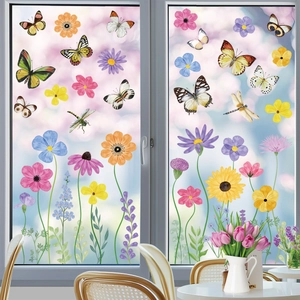 Floral and butterfly static window stickers in a sunlit interior with garden view