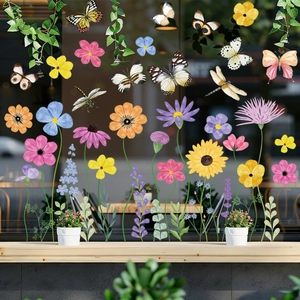 Detailed close-up of butterfly and flower static stickers on a glass window with soft lighting