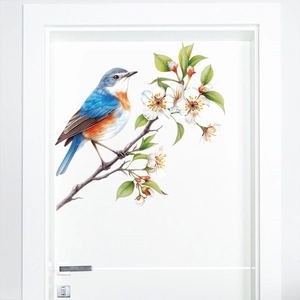 Detail of a bird and white blossom sticker on a modern white door with clean textures