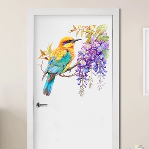 Colorful bird on wisteria branch wall decal sticker displayed on a white wooden door