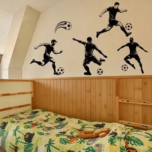 Black silhouette wall decals featuring soccer players and balls for sports room decor