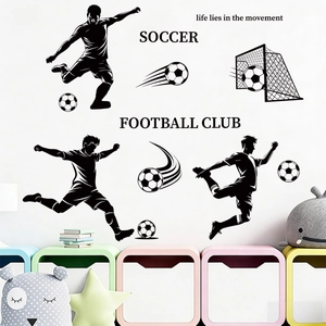 Detail view of soccer player silhouettes and goal stickers in a bright kids room setup