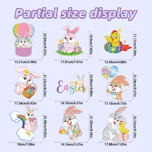 Size chart showing 9 detailed Easter window stickers with rabbits and rainbow eggs in cm/in