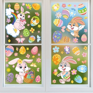 Detailed view of colorful Easter bunny stickers and floral eggs on a window pane