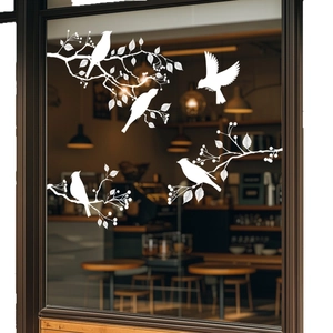 White bird silhouette window stickers on glass featuring branches for home decoration