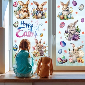 Close-up of Easter window stickers featuring watercolor bunnies and eggs on glass
