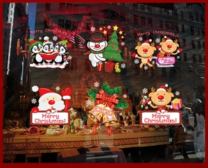 Detail of Santa Claus and reindeer window clings showing festive Christmas decorations
