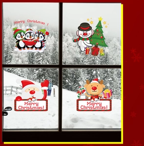 Detail of Christmas window stickers featuring Santa, snowman, and reindeer on glass pane