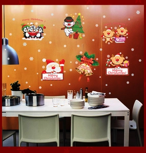 Detail of Christmas wall stickers featuring Santa, reindeer, and snowflakes on a wall