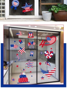 Detail view of July 4th patriotic window clings with stars and stripes on glass
