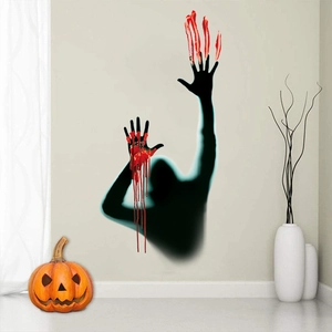 Close-up of Halloween wall stickers featuring realistic bloody handprints and black silhouettes