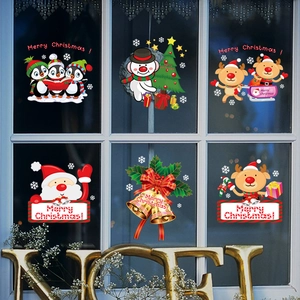 Christmas window decals featuring Santa, reindeer, and snowman on glass window panes