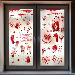 Detailed view of Halloween bloody handprints and scary text decals on glass windows