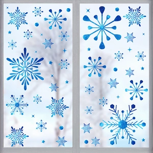 Close-up of blue snowflake static window clings set on a glass window in winter