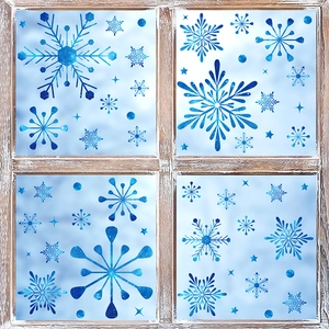 Detailed blue snowflake window clings with starry texture on vintage wood window frame
