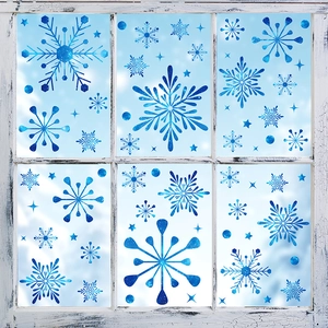 Blue glitter snowflake static window stickers applied on a vintage wooden window pane