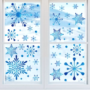 Detail of blue gradient snowflake stickers with galaxy texture on a window pane
